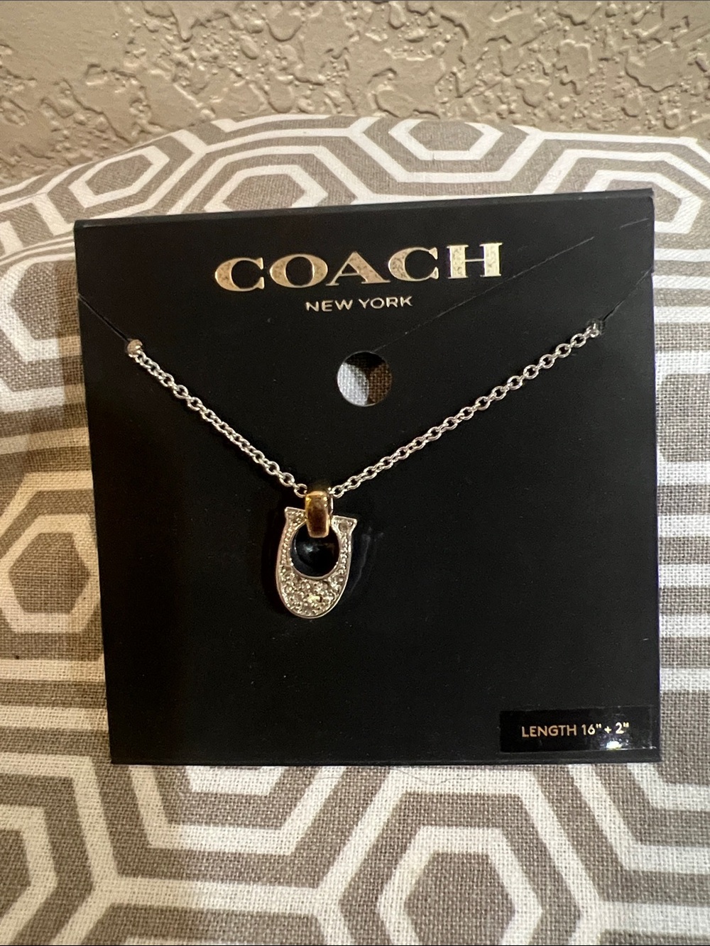 COACH Two-Tone Silver and Gold Horseshoe Pendant Necklace